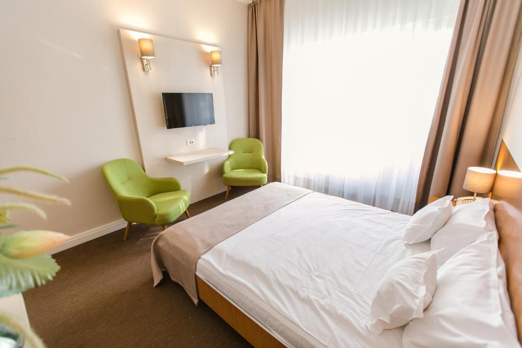 Postel nebo postele na pokoji v ubytování Hotel Nufarul
