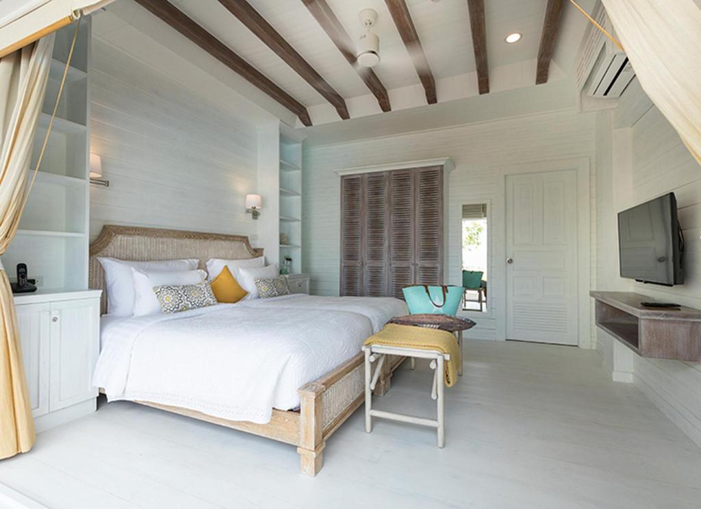 Postel nebo postele na pokoji v ubytování Cape Kudu Hotel, Koh Yao Noi