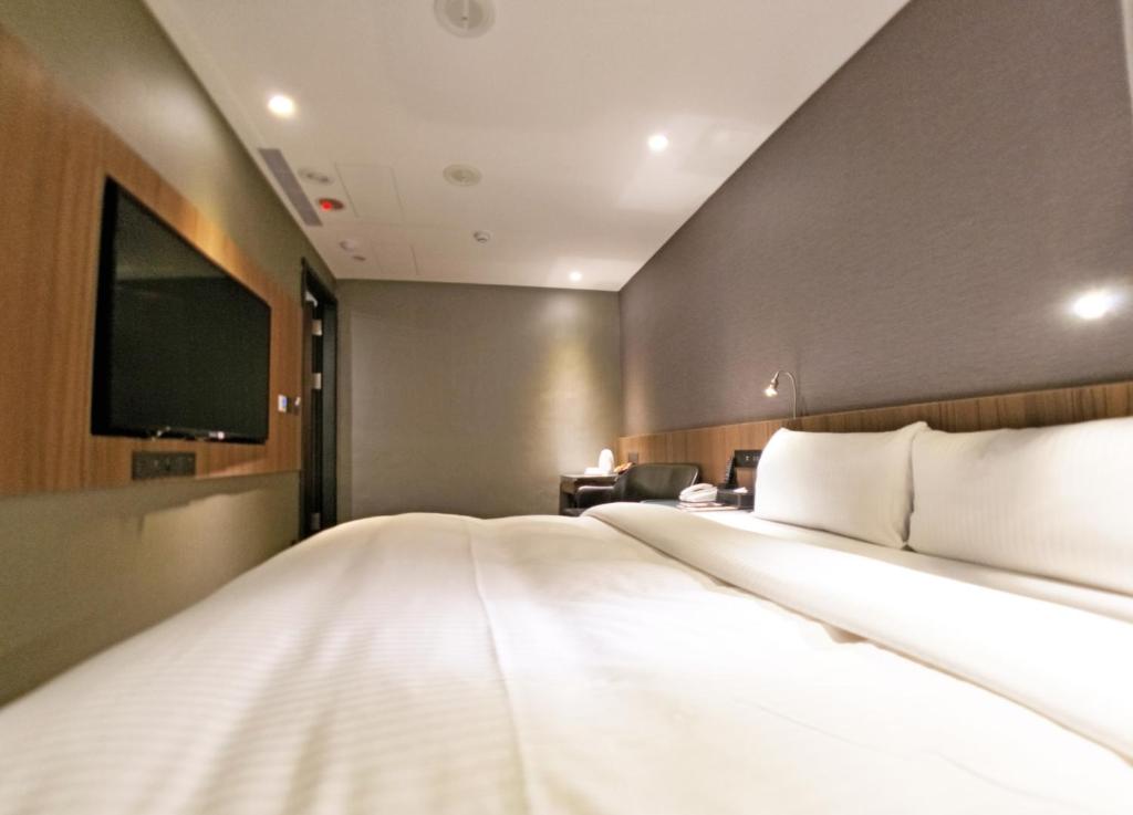 Postel nebo postele na pokoji v ubytování Beauty Hotels Taipei - B7 Journey