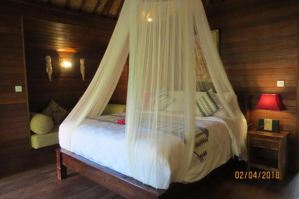 Postel nebo postele na pokoji v ubytování Pondok Lembongan