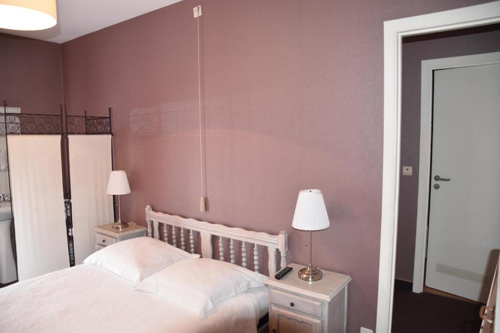 Postel nebo postele na pokoji v ubytování Hotel Le Barbouillon