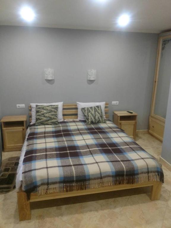 Postel nebo postele na pokoji v ubytování Садиба "У Юлії"