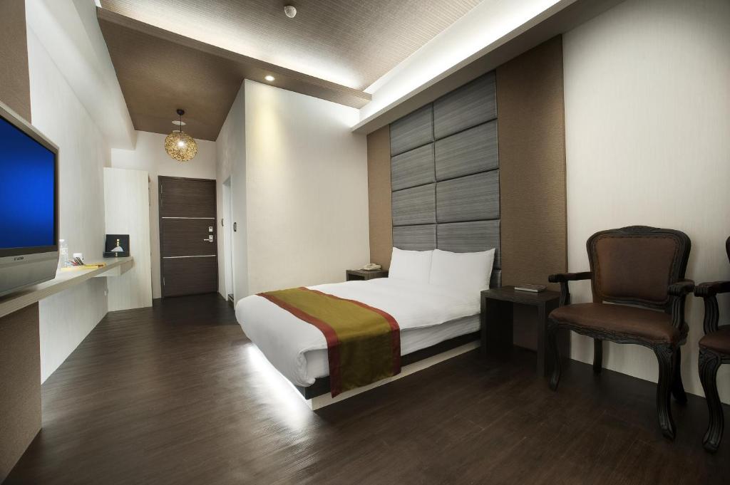 TV a/nebo společenská místnost v ubytování One Fukun Hotel