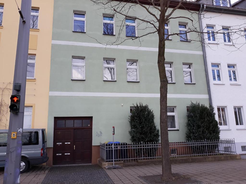 a large white building with a brown door at Aleksandra & Daria in Erfurt