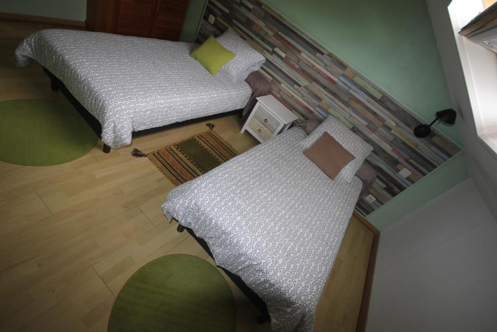 Postel nebo postele na pokoji v ubytování Le Rubinjo - Appartement d'hôtes