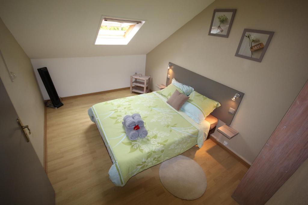 Postel nebo postele na pokoji v ubytování Le Rubinjo - Appartement d'hôtes