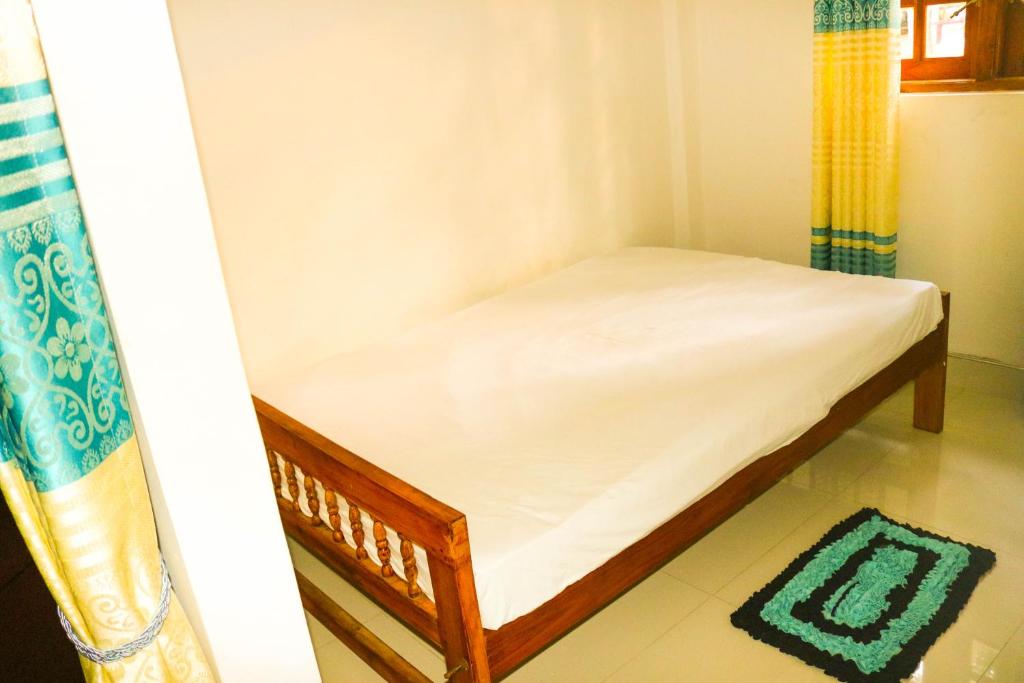 Postel nebo postele na pokoji v ubytování Thuruliya Residence