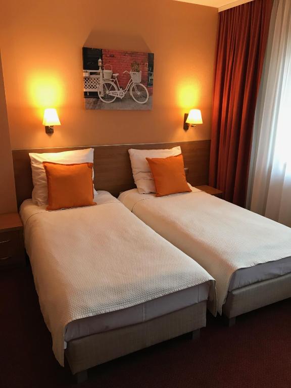 Posteľ alebo postele v izbe v ubytovaní Hotel Restauracja Willa Radwan