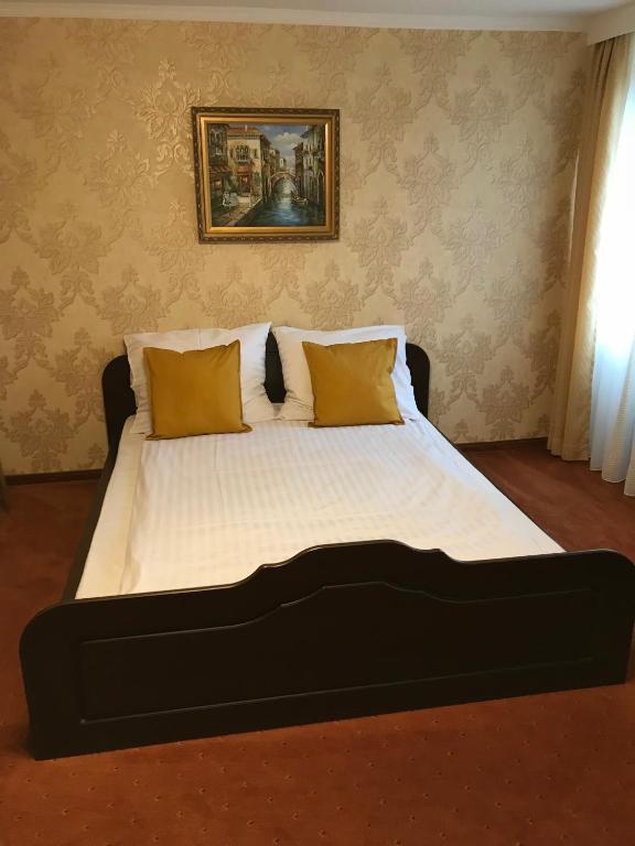 Posteľ alebo postele v izbe v ubytovaní Hotel Restauracja Willa Radwan