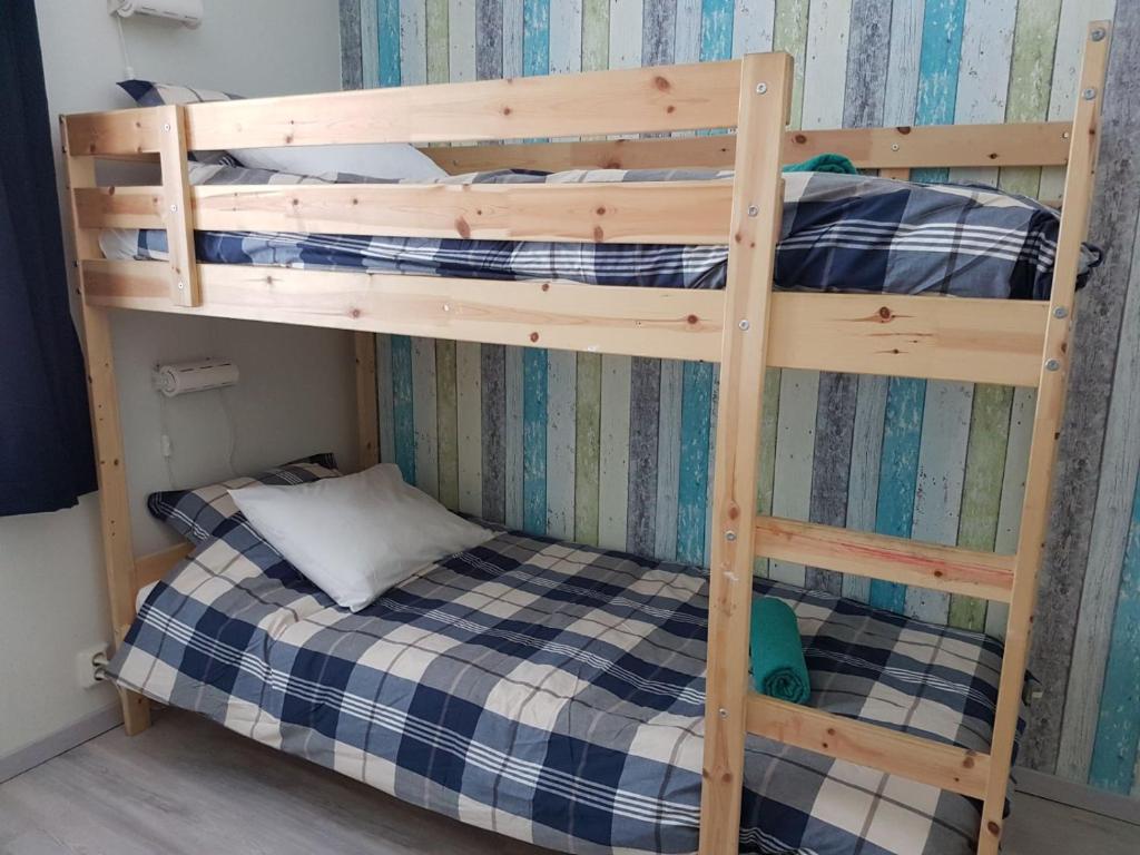 Postel nebo postele na pokoji v ubytování Den Sovande Älgen
