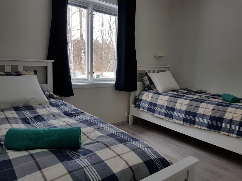 Postel nebo postele na pokoji v ubytování Den Sovande Älgen