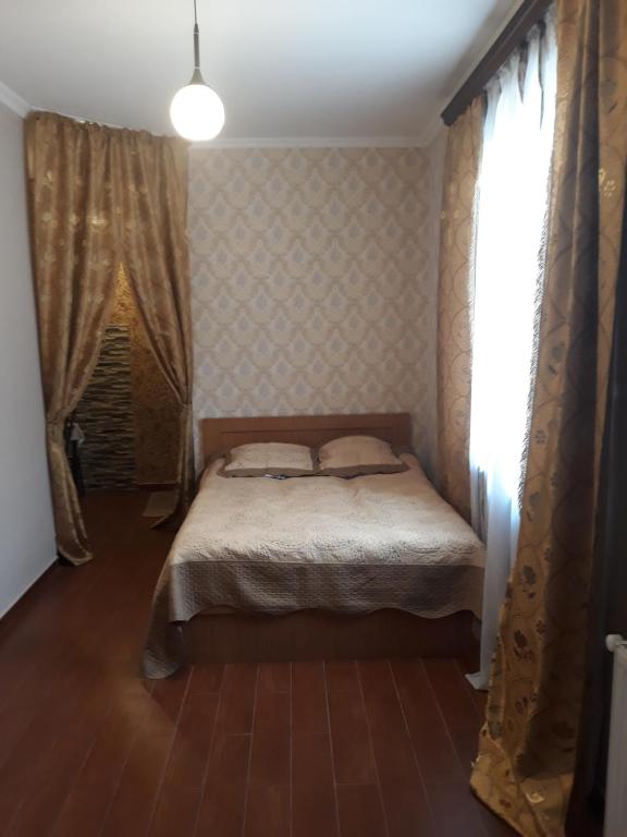 Postel nebo postele na pokoji v ubytování Guesthouse Gia
