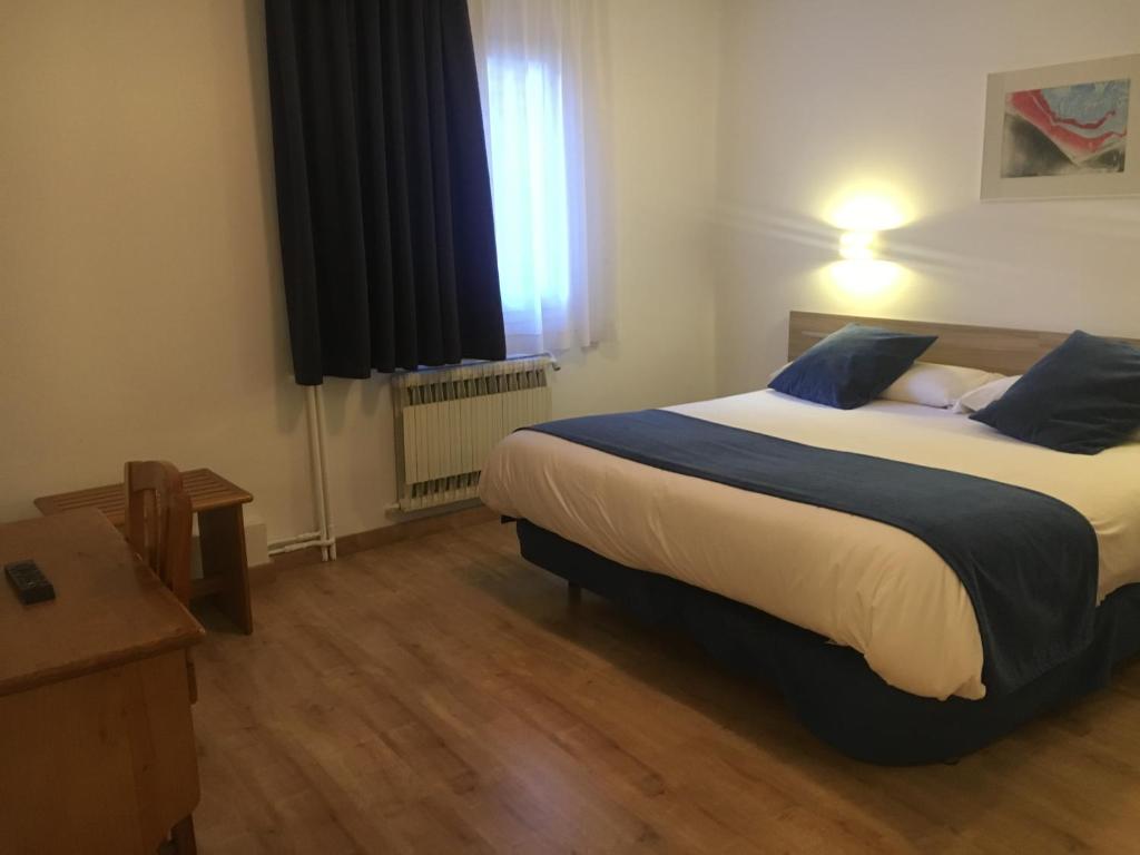 Postel nebo postele na pokoji v ubytování Hotel Marxant