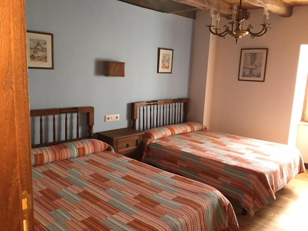 Postel nebo postele na pokoji v ubytování Casa Rural Lenco