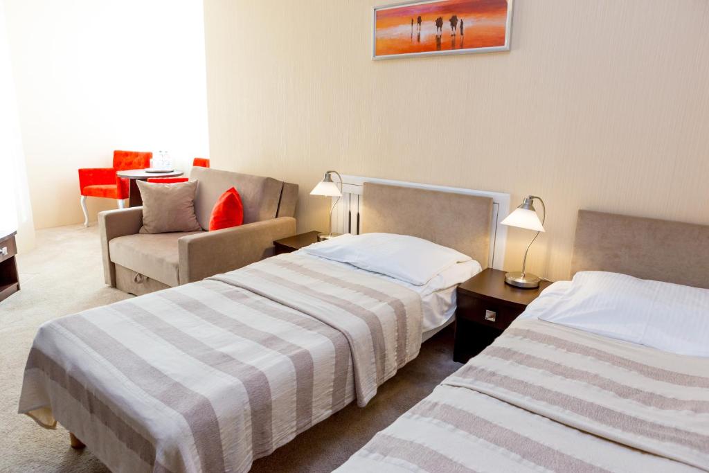 Posteľ alebo postele v izbe v ubytovaní Hotel Alexandra
