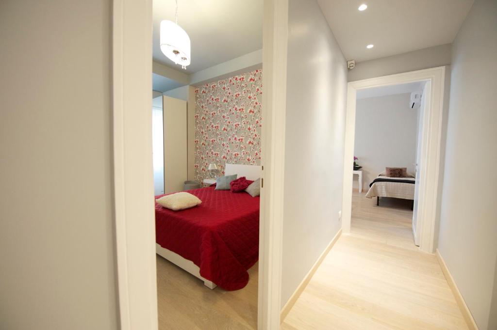 A bed or beds in a room at Quartopiano Guesthouse