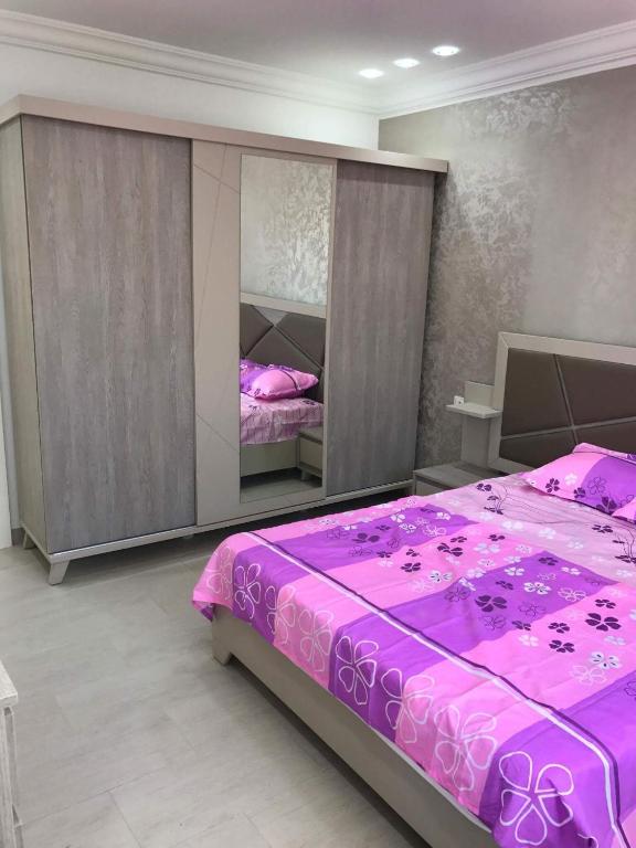 Postel nebo postele na pokoji v ubytování Dar lotfi