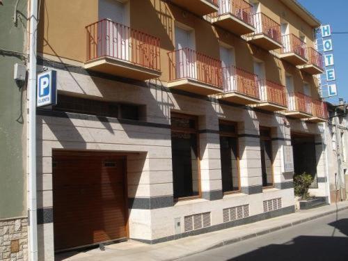 a building with balconies on the side of a street at Hotel Venta de la Punta in Santa Bárbara