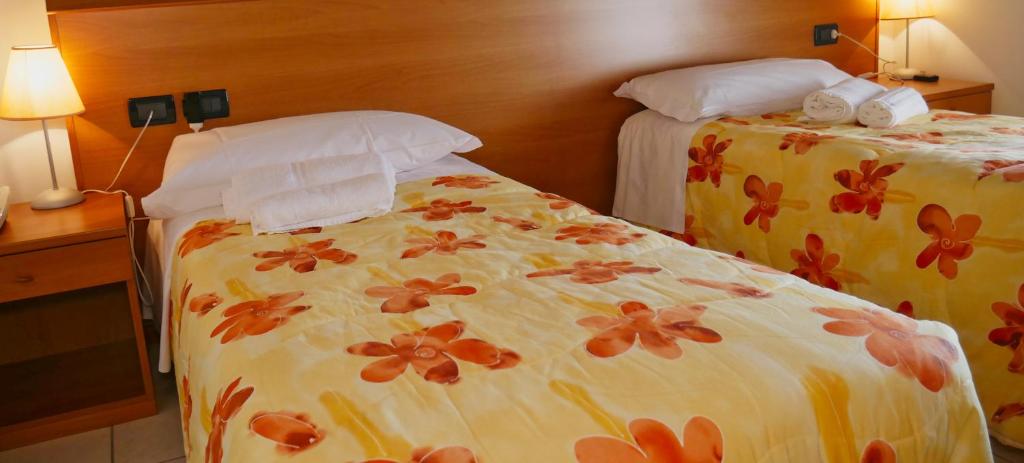 Postel nebo postele na pokoji v ubytování hotel Vajont