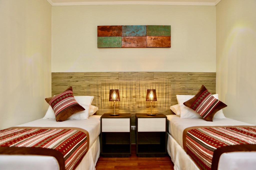 Postel nebo postele na pokoji v ubytování Yakana Hotel