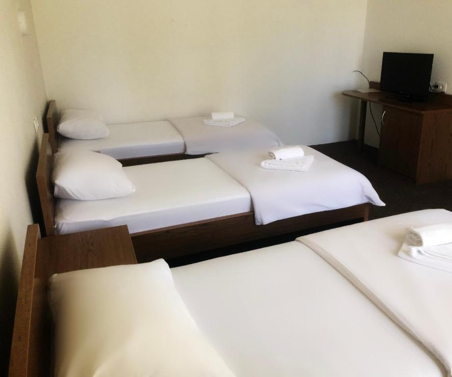 Postel nebo postele na pokoji v ubytování Hotel Onogošt