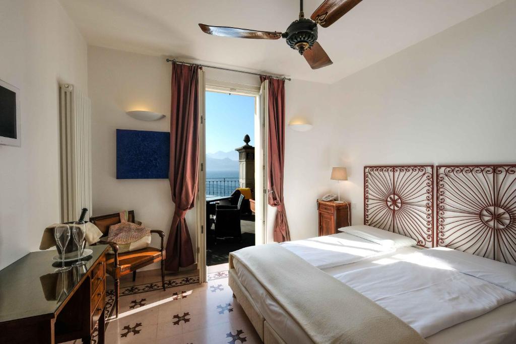 Posteľ alebo postele v izbe v ubytovaní Albergo Milano