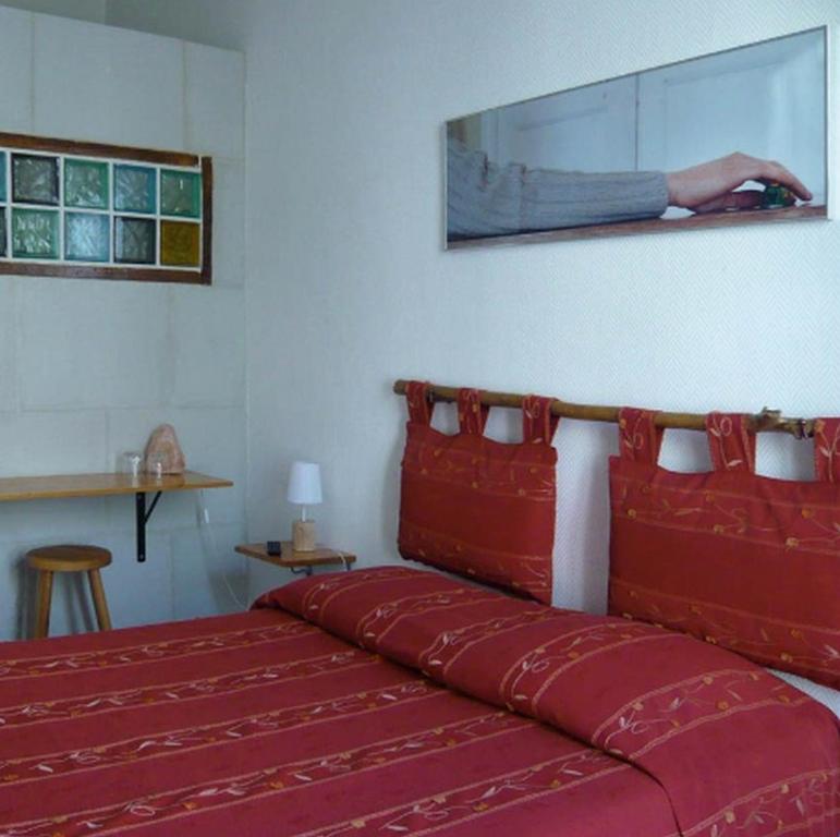 Un ou plusieurs lits dans un hébergement de l'établissement Hotel Wilson