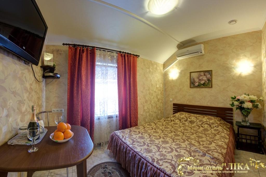 Postel nebo postele na pokoji v ubytování Лика Отель