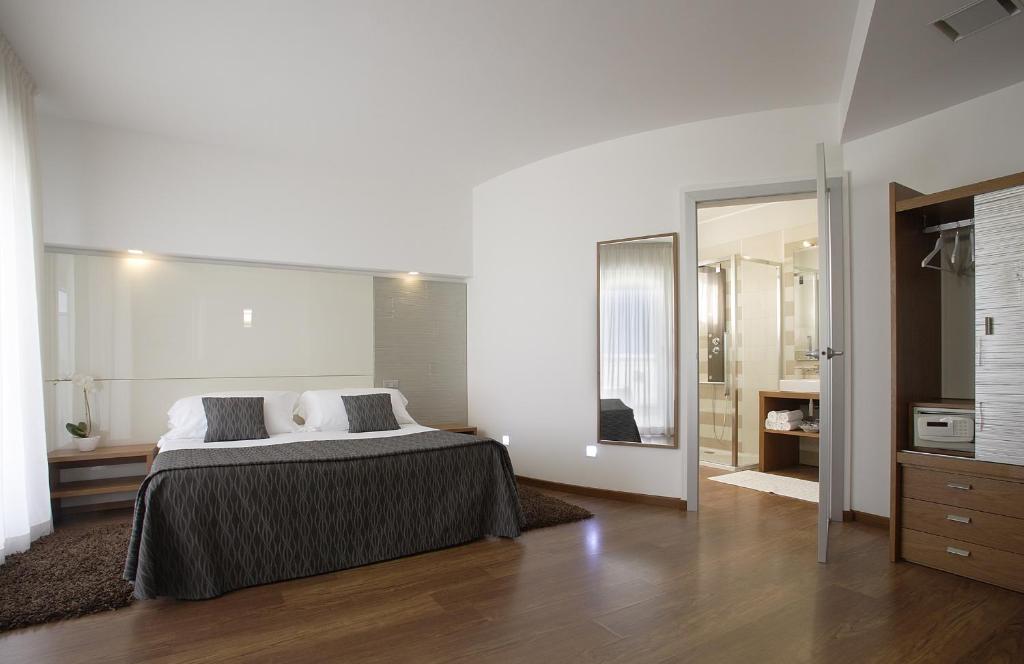 Posteľ alebo postele v izbe v ubytovaní Park Hotel Ermitage Resort & Spa