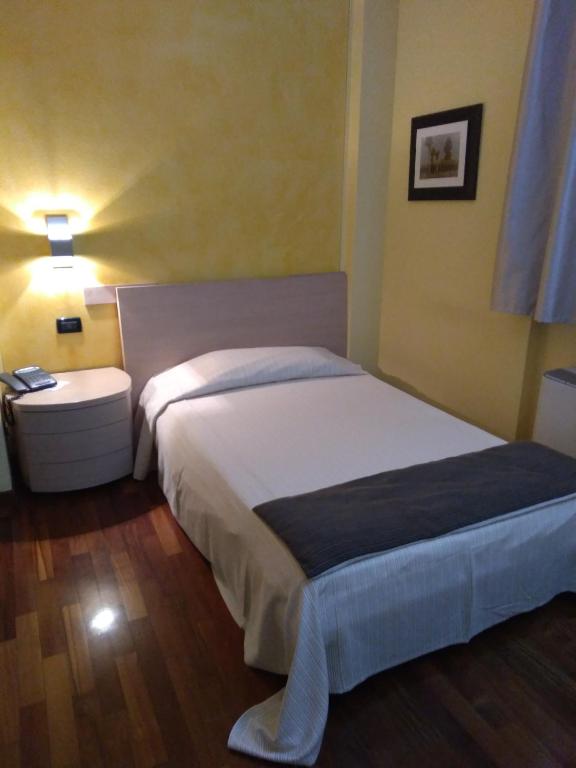 Postel nebo postele na pokoji v ubytování Hotel Fontana Santa
