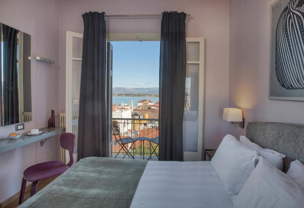 Postel nebo postele na pokoji v ubytování Leto Nuevo Hotel