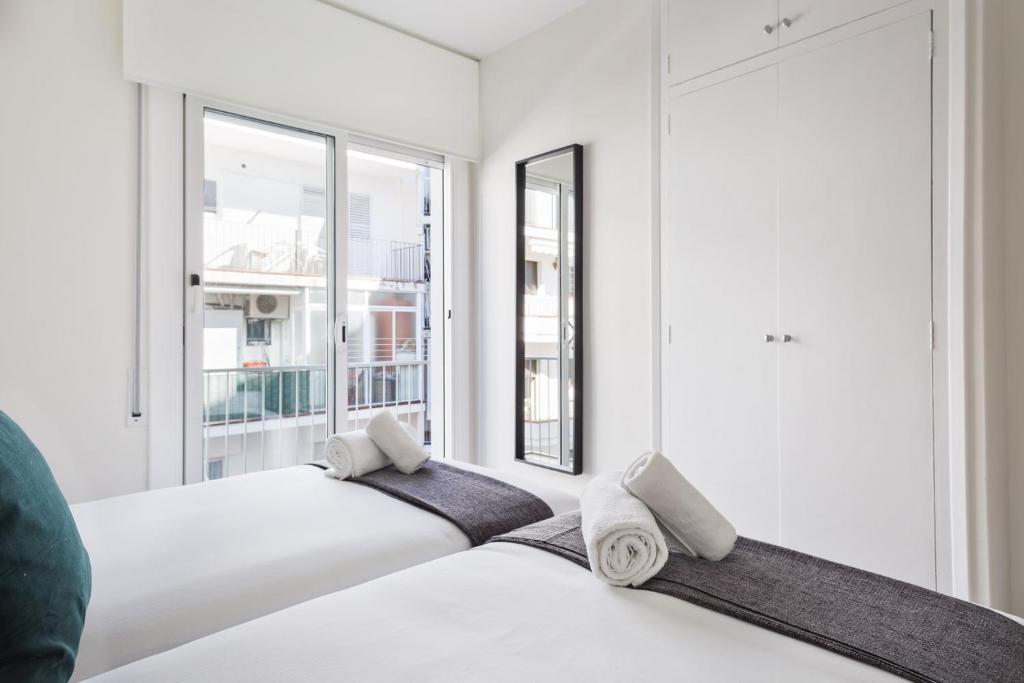 A bed or beds in a room at Sitges Group Calm Beach