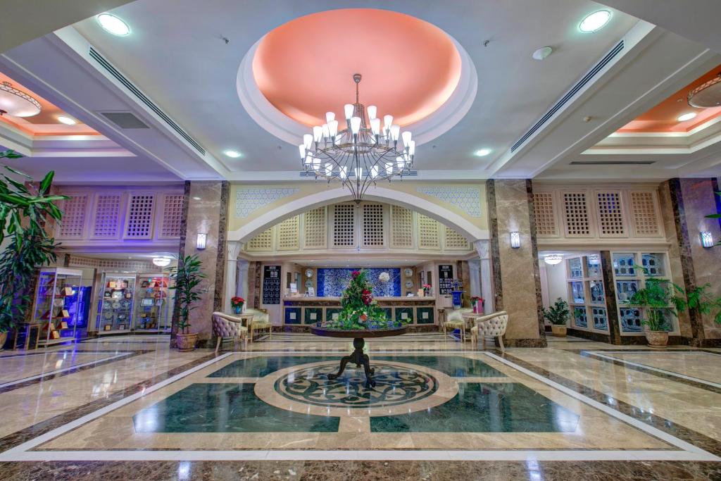 a lobby with a christmas tree in a fountain at Merit Lefkosa Hotel & Casino in North Nicosia