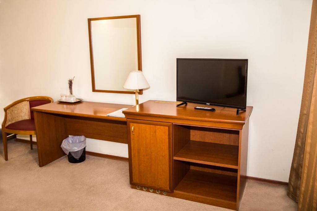 TV a/nebo společenská místnost v ubytování Hotel Seven