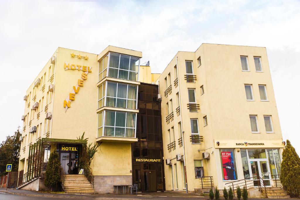 a building with a sign on the side of it at Hotel Seven in Cluj-Napoca