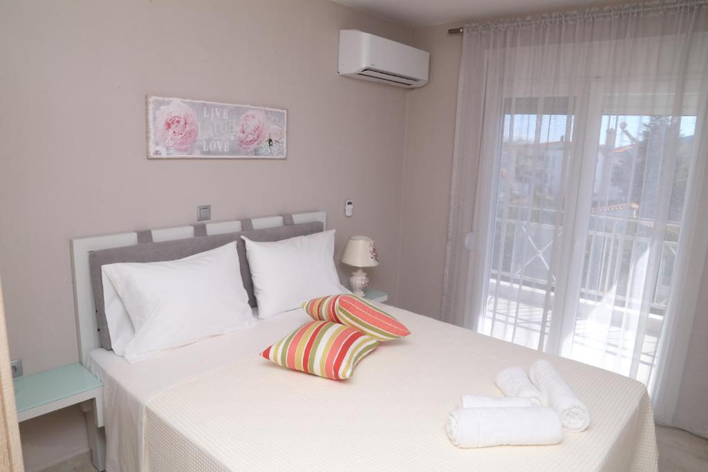 Postel nebo postele na pokoji v ubytování R&K Suites