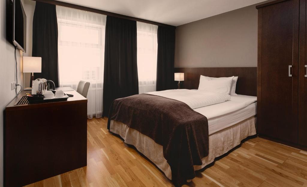 Postel nebo postele na pokoji v ubytování Hotel Kea by Keahotels