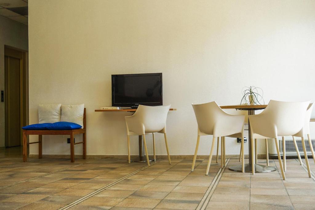 TV a/nebo společenská místnost v ubytování Albergo Ristorante Saverino
