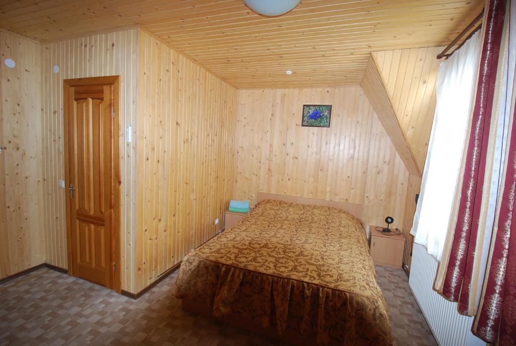 Postel nebo postele na pokoji v ubytování Zelena Dacha