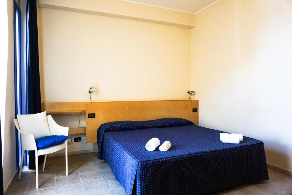 Postel nebo postele na pokoji v ubytování Albergo Ristorante Saverino