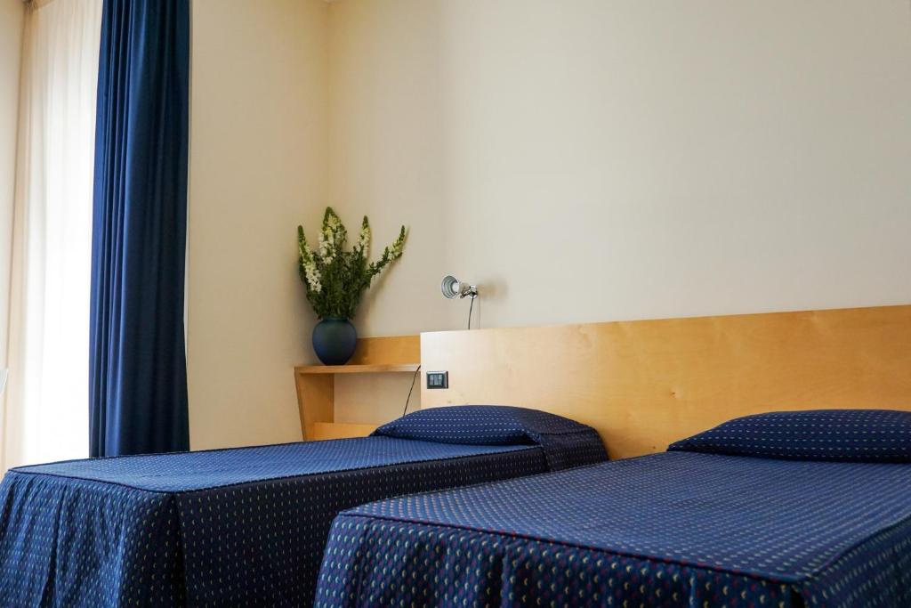 Postel nebo postele na pokoji v ubytování Albergo Ristorante Saverino