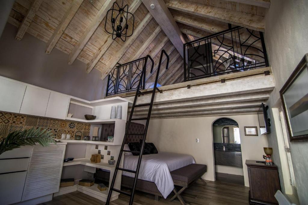 Postel nebo postele na pokoji v ubytování Hotel de Piedra