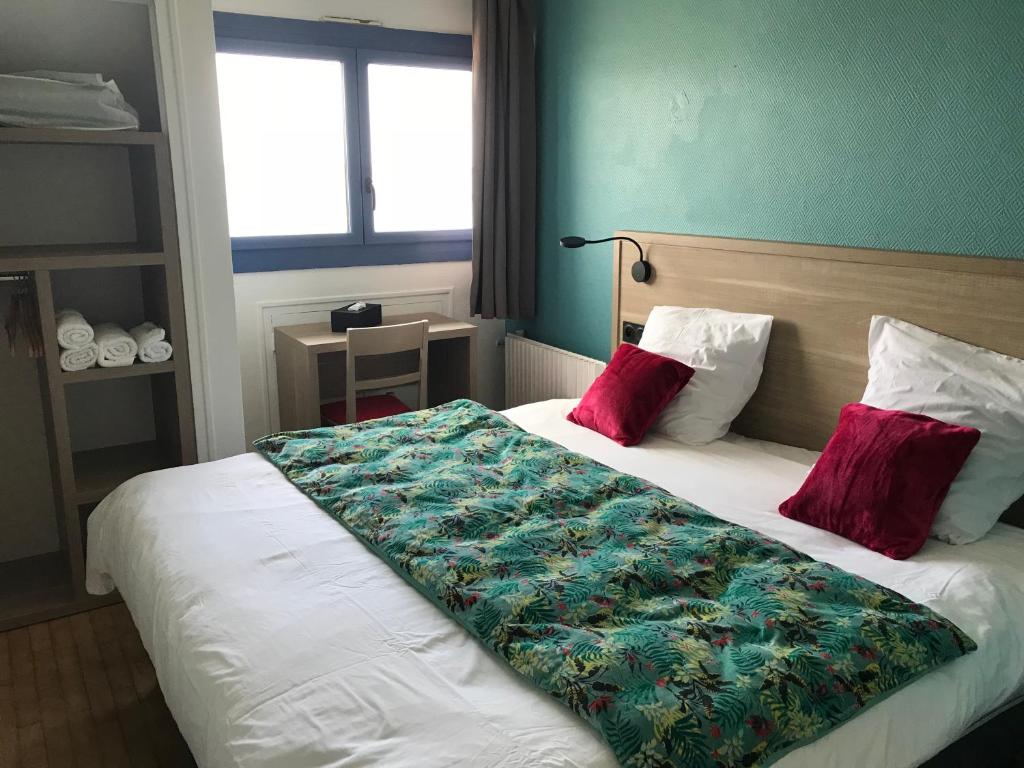 Postel nebo postele na pokoji v ubytování Hôtel Restaurant L'Escale d'en Arz