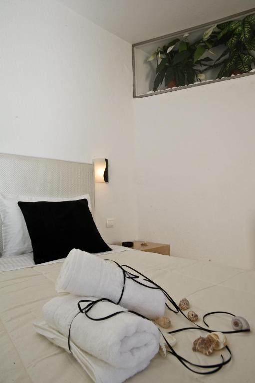 Postel nebo postele na pokoji v ubytování Zannis Hotel