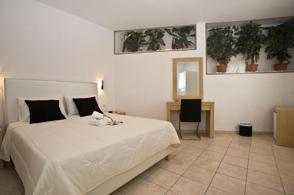 Postel nebo postele na pokoji v ubytování Zannis Hotel