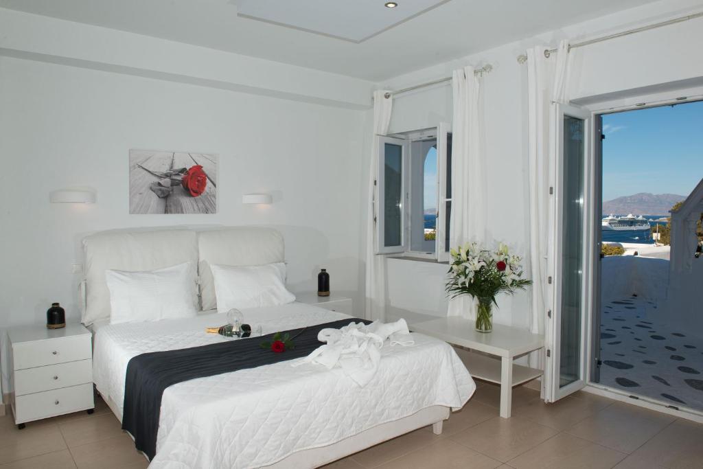 Postel nebo postele na pokoji v ubytování Zannis Hotel
