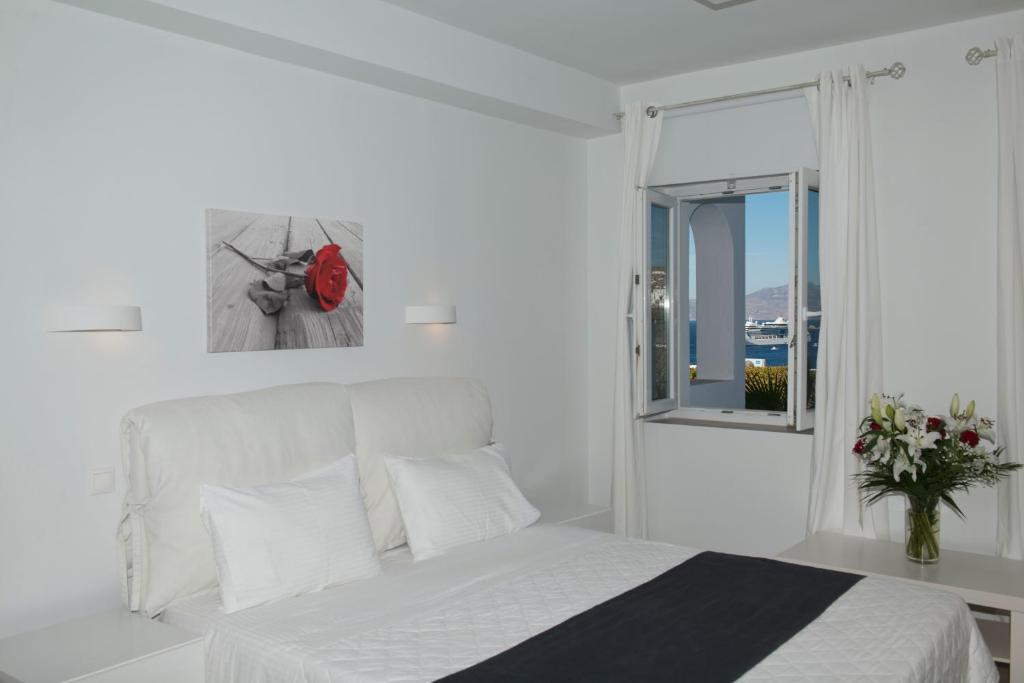 Postel nebo postele na pokoji v ubytování Zannis Hotel