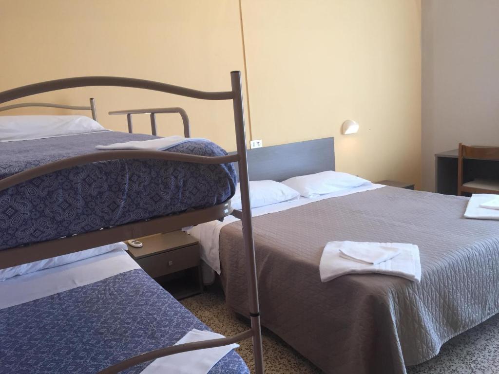 Postel nebo postele na pokoji v ubytování Hotel Britta