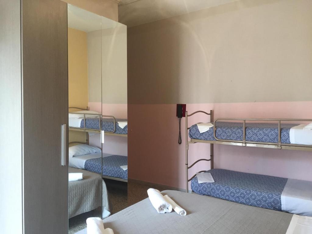 Postel nebo postele na pokoji v ubytování Hotel Britta