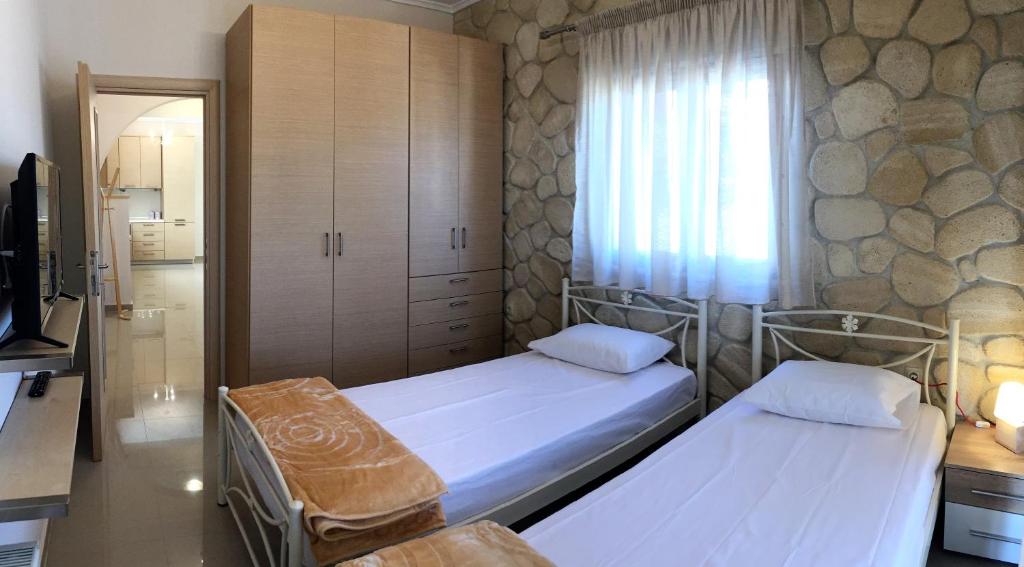 Posteľ alebo postele v izbe v ubytovaní Amfithea House